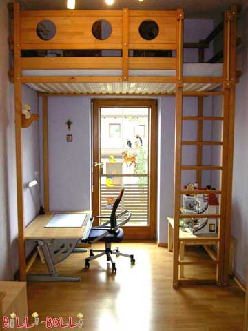 Depicted is a custom-built product: the bed has been mounted above the door with very tall legs and a high fall guard.