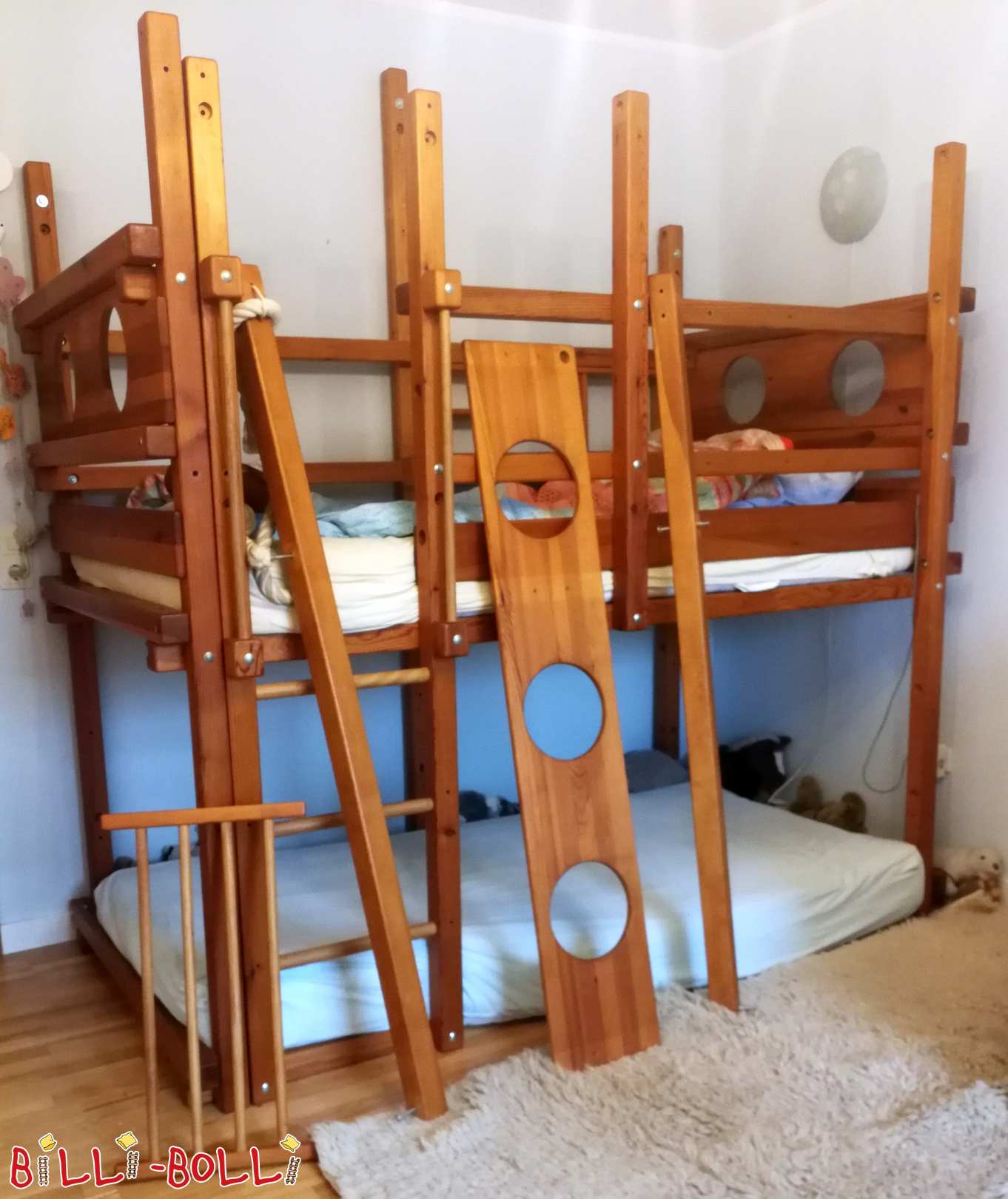 Honey-colored pine loft bed with porthole-themed boards (Category: second hand loft bed)